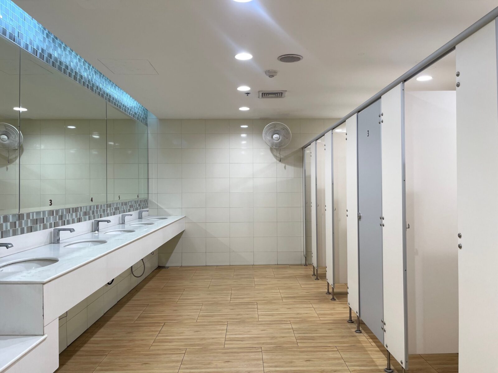 Row,of,public,toilet,decoration,with,blue,color,partition